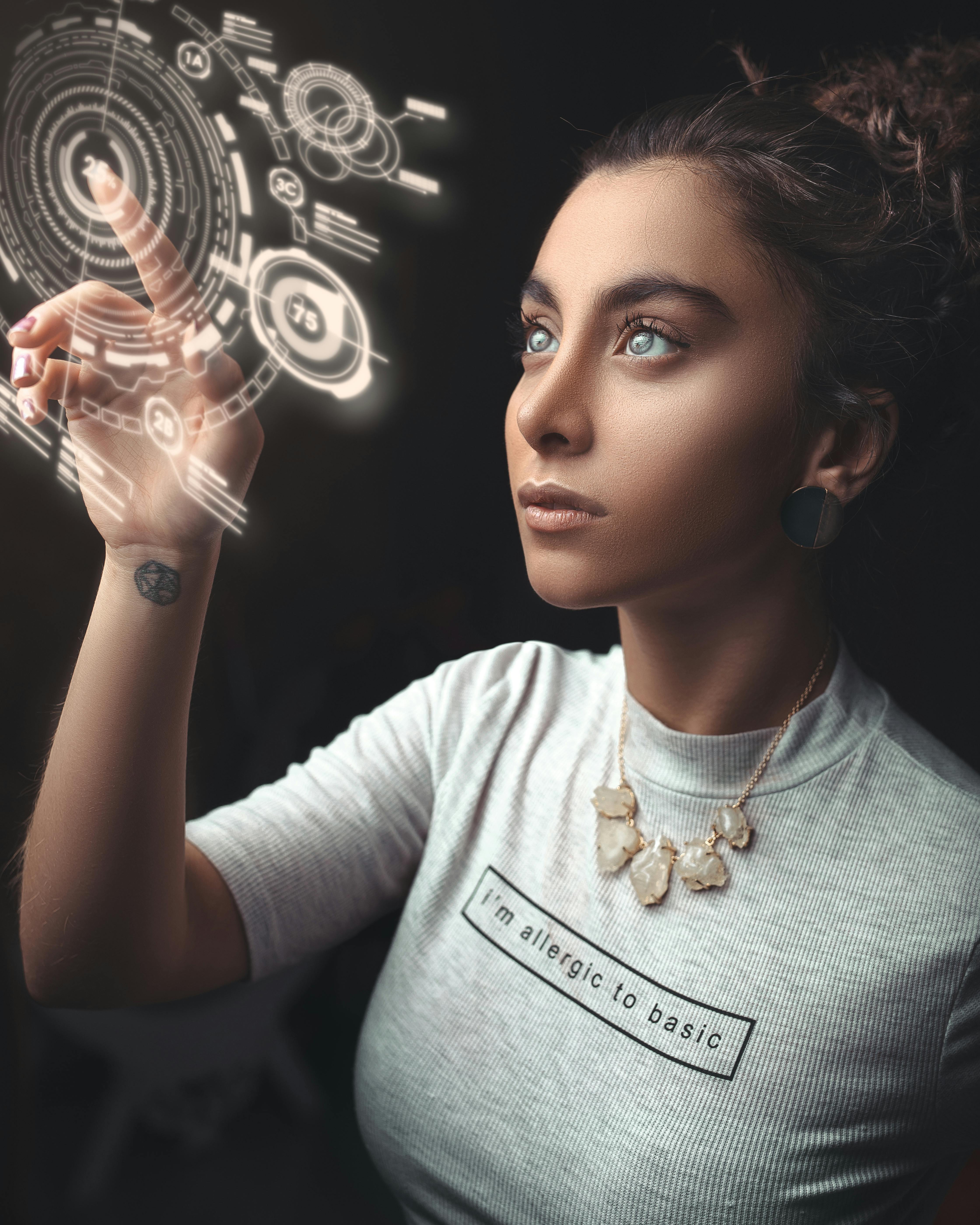 Woman controlling futuristic technology